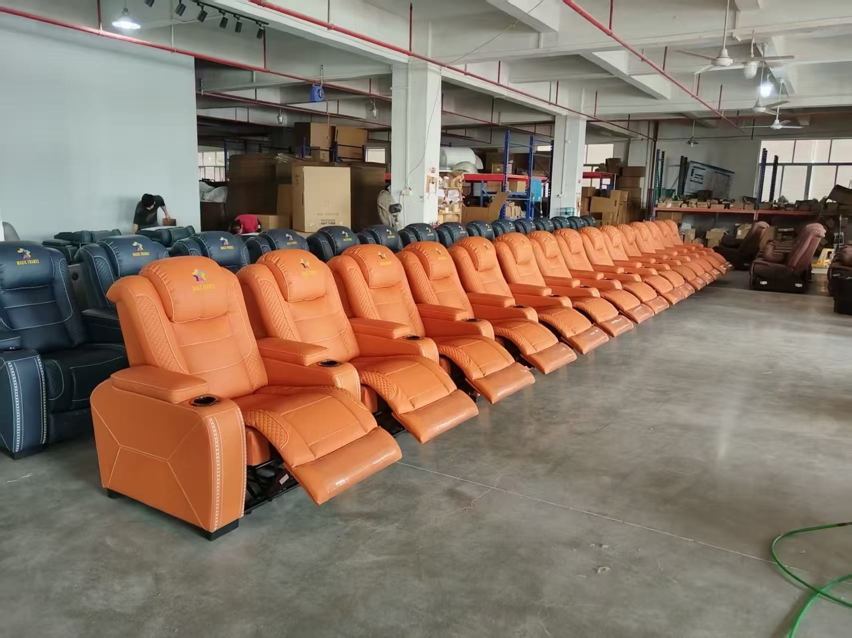 Tan recliner cinema seat with quilted side panels
