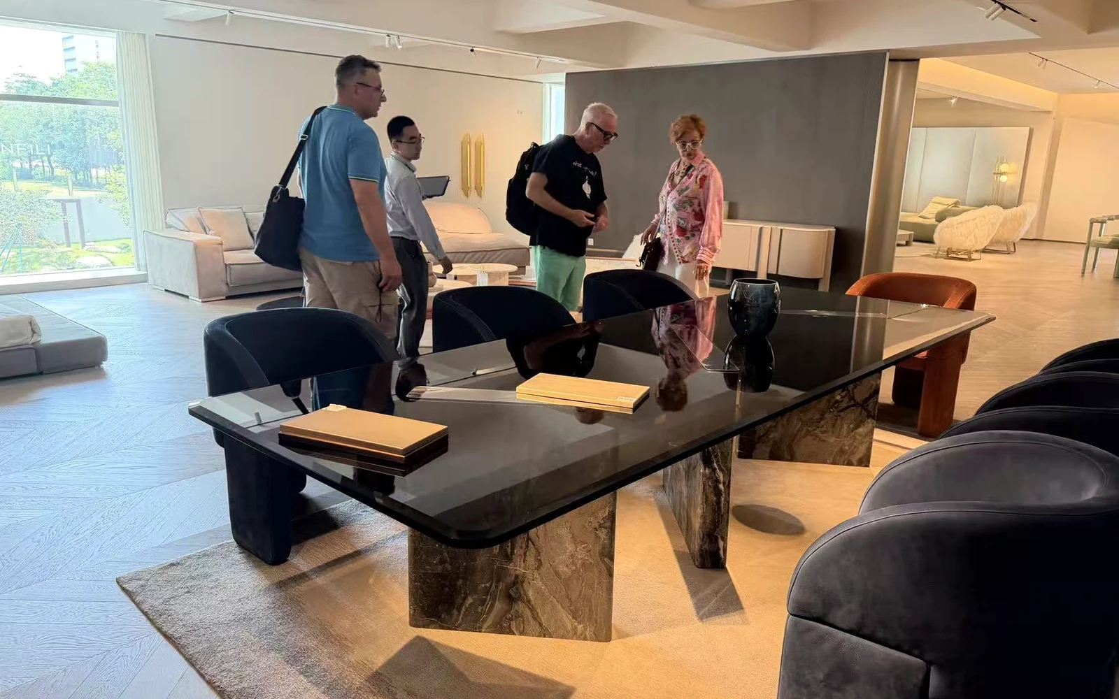 Overseas buyers reviewing furniture in a Foshan showroom